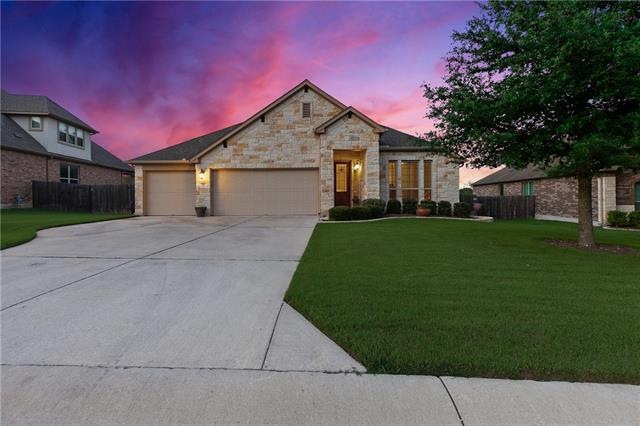 3 Car garage and beautiful Sandstone elevation with glass front door for even more light!  Immaculate yard.