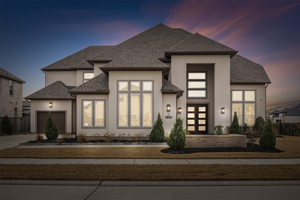 Modern, two-story home with a well-maintained fron