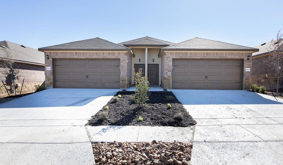 Single story home with roof with shingles, concrete driveway, and a garage