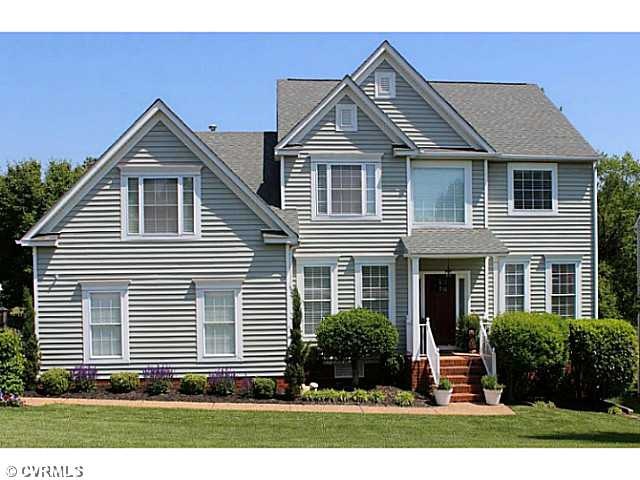 Exterior Front - Beautifully landscaped home with 