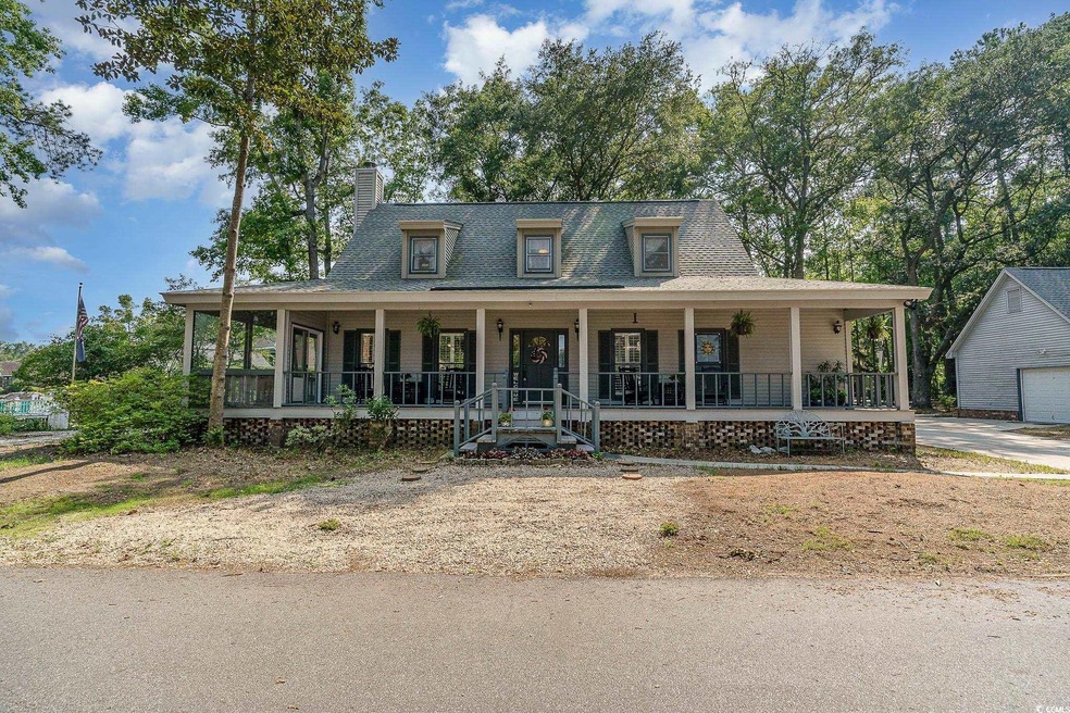 Farmhouse-style home featuring a porch
