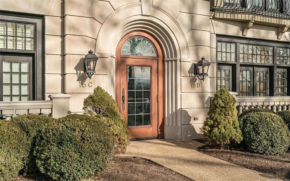 Handsome entrance flanked by gas lights.  This out