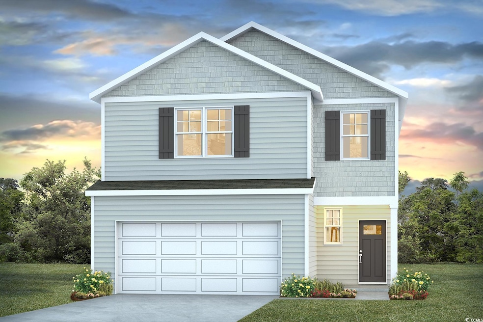 View of front of home with a garage, a lawn, and c