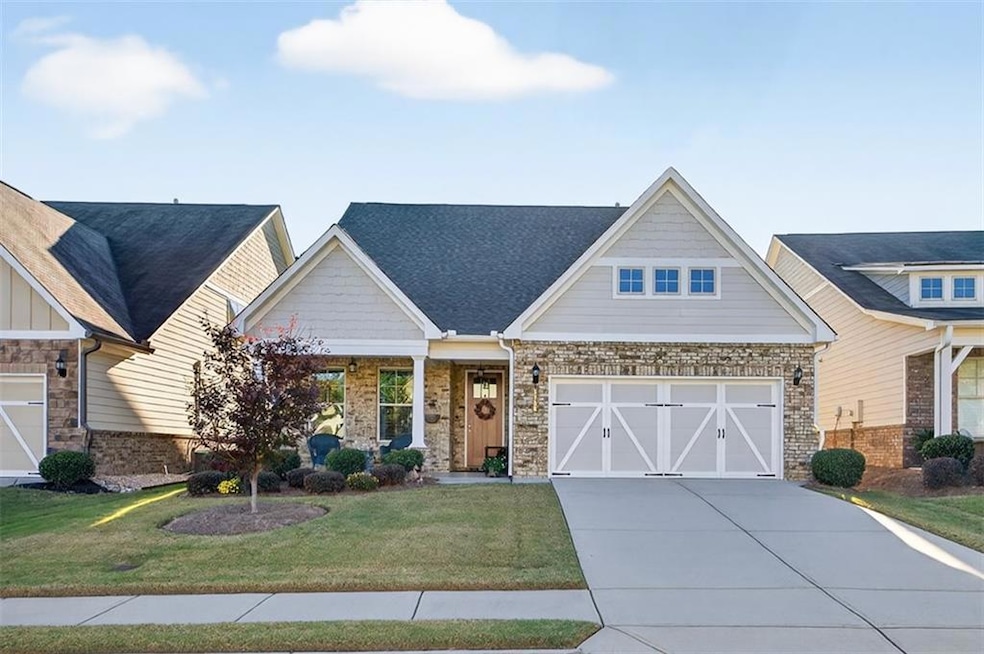Craftsman inspired home with a porch, a front lawn, concrete driveway, a garage, and a shingled roof