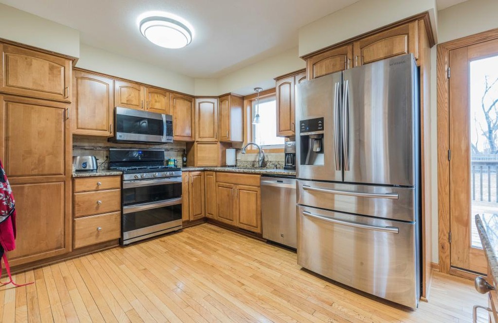 Updated appliances, flooring, counters and lightin
