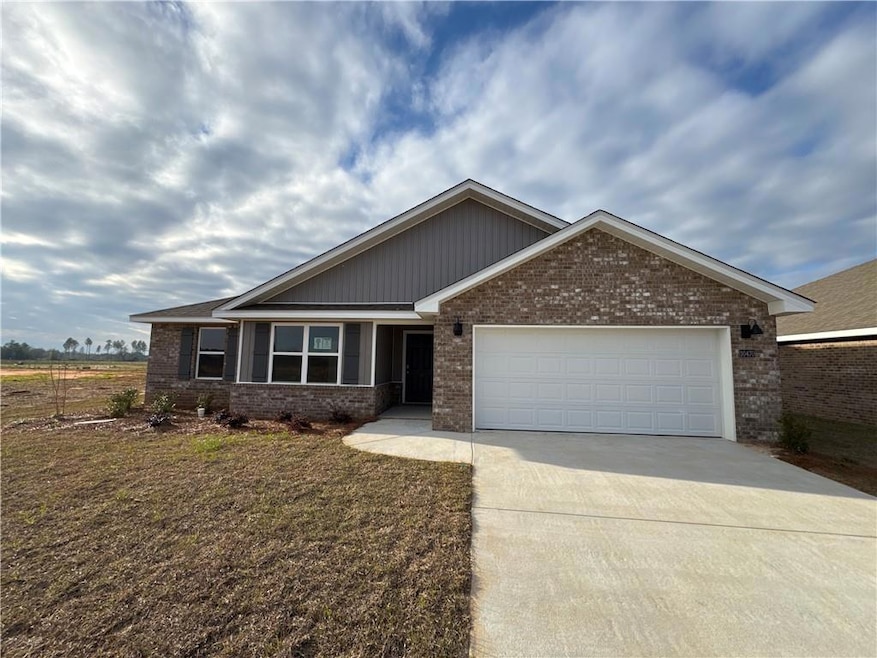 View of front of home featuring a garage, concrete