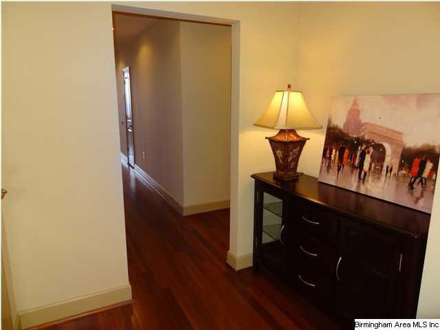 Charming entry with wood floors, coat closet and l
