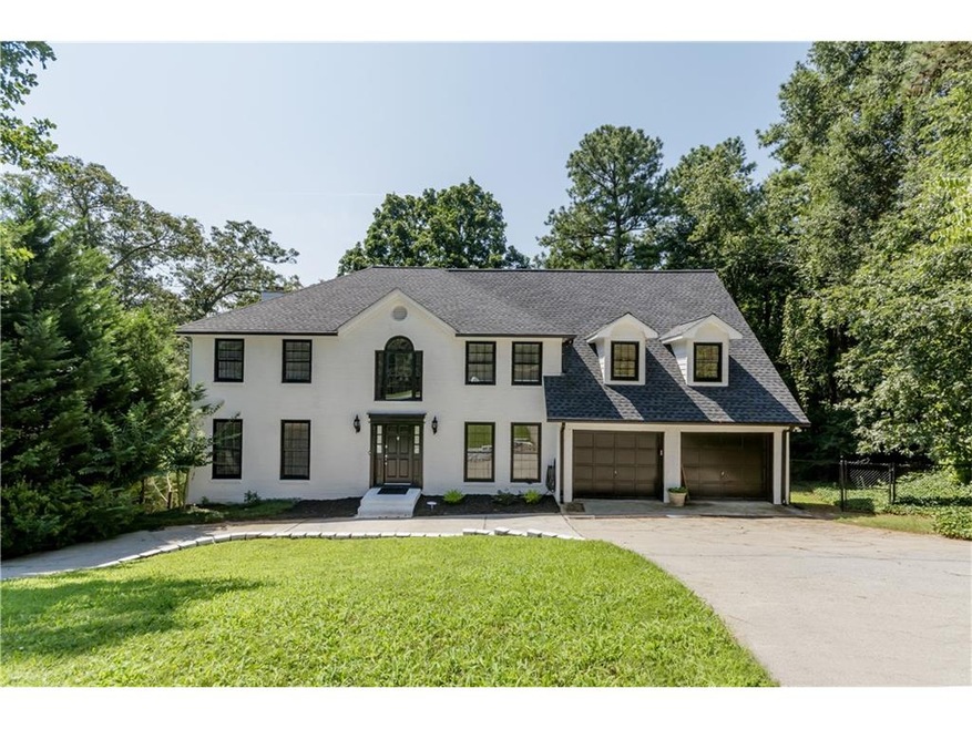Stunning renovation on private wooded lot!