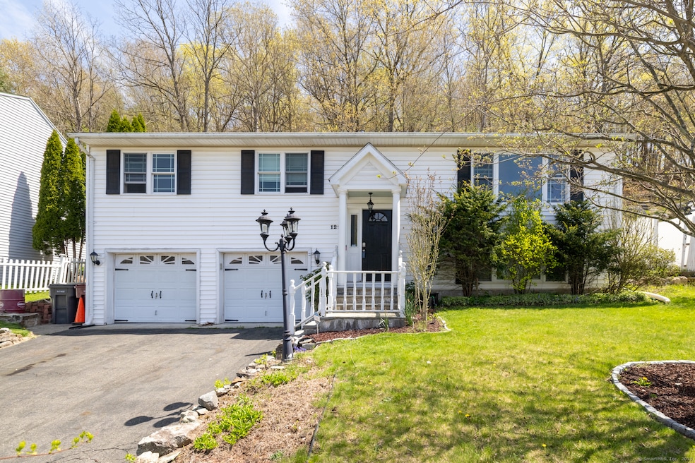 Nicely updated raised ranch with 2 car garage and 