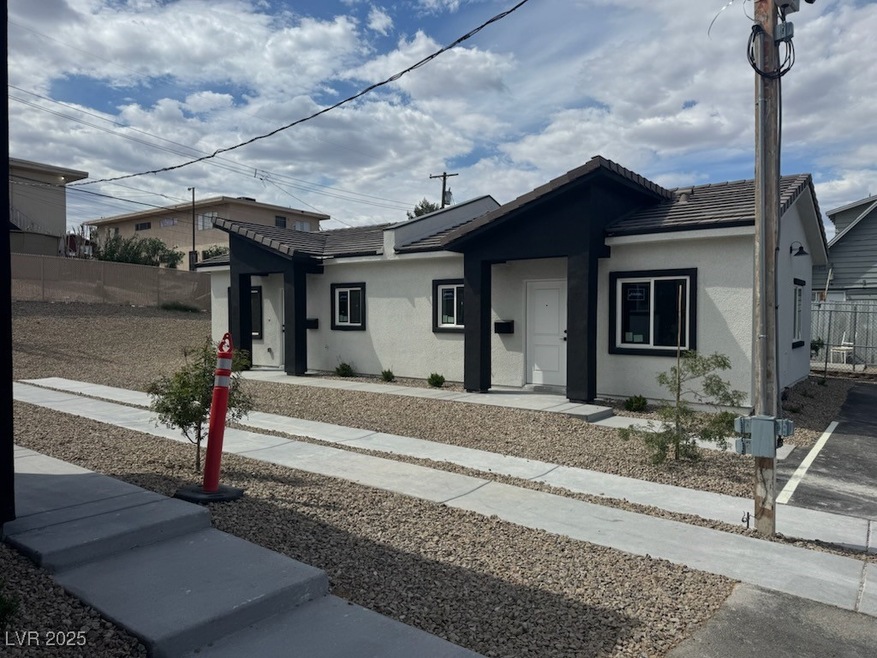 Ranch-style house featuring fence, stucco siding,