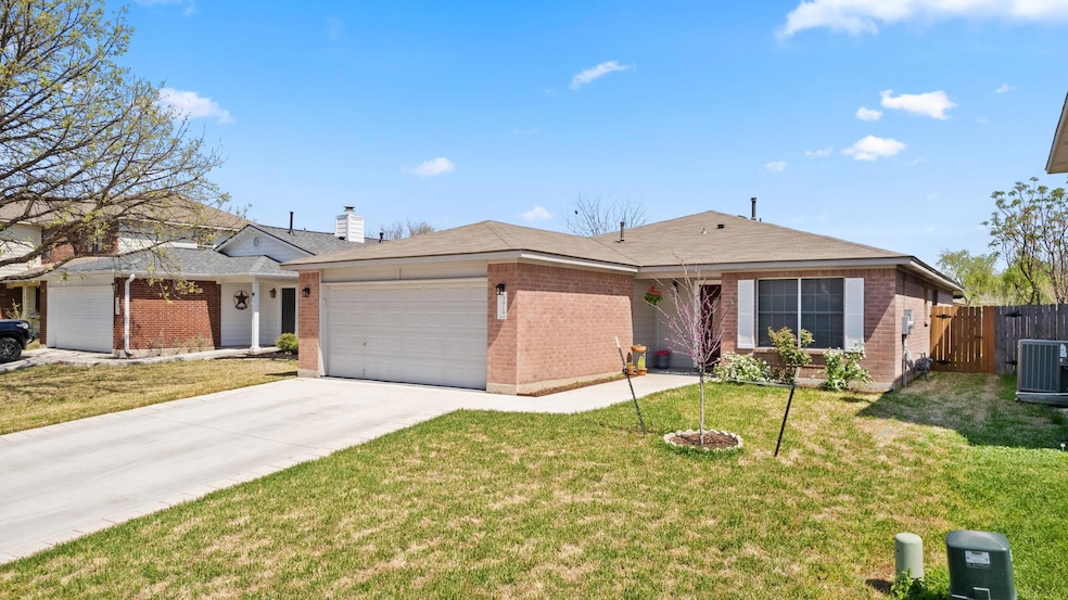 Single story home featuring cooling unit, brick s