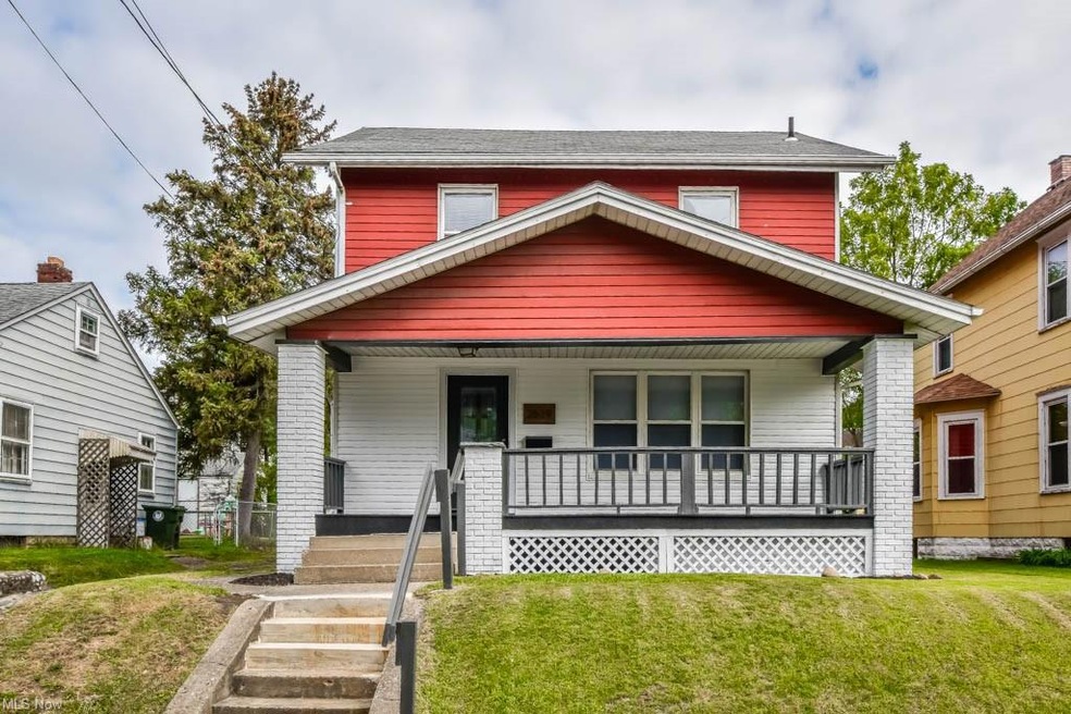 View of front facade with a porch and a front yard