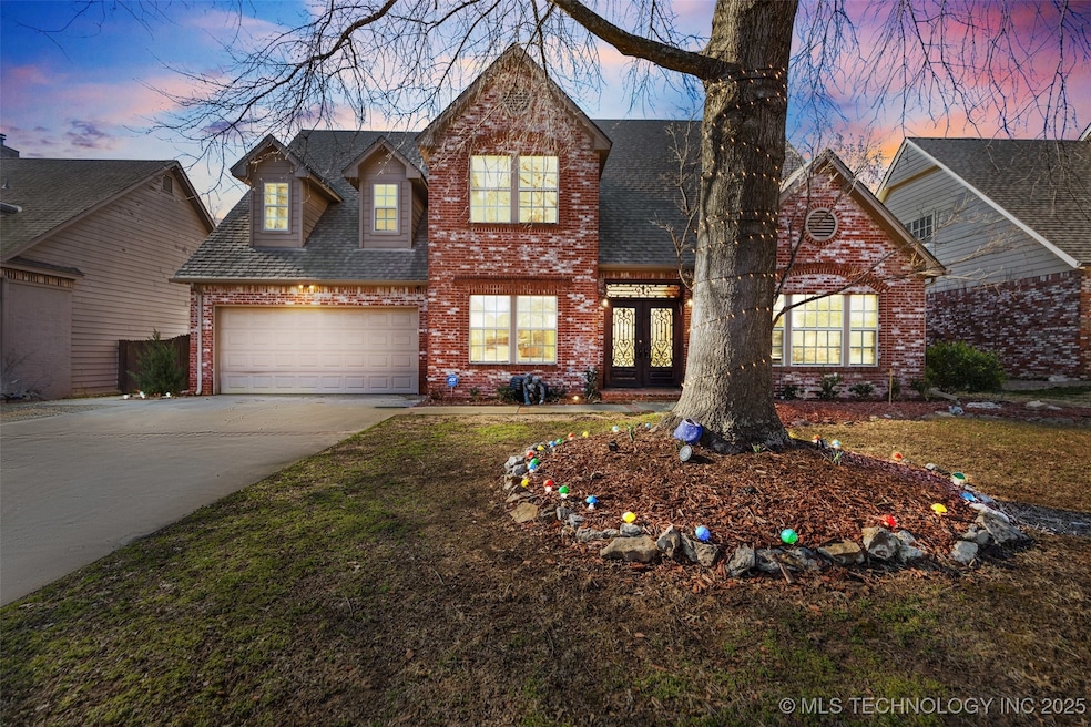 Traditional-style home with brick siding, french d
