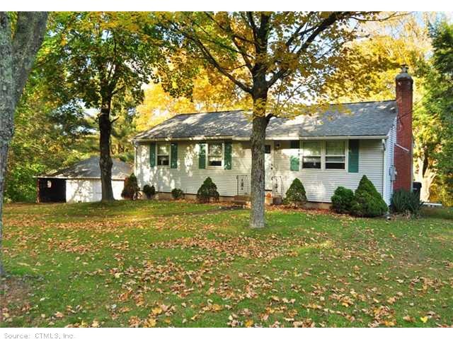 Exterior Front. Mature trees in front yard help pr