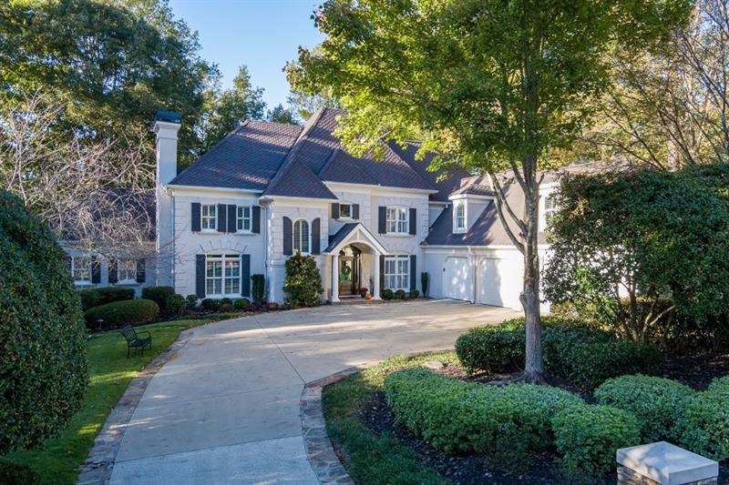 Gorgeous, level driveway and 4 car garage home on 