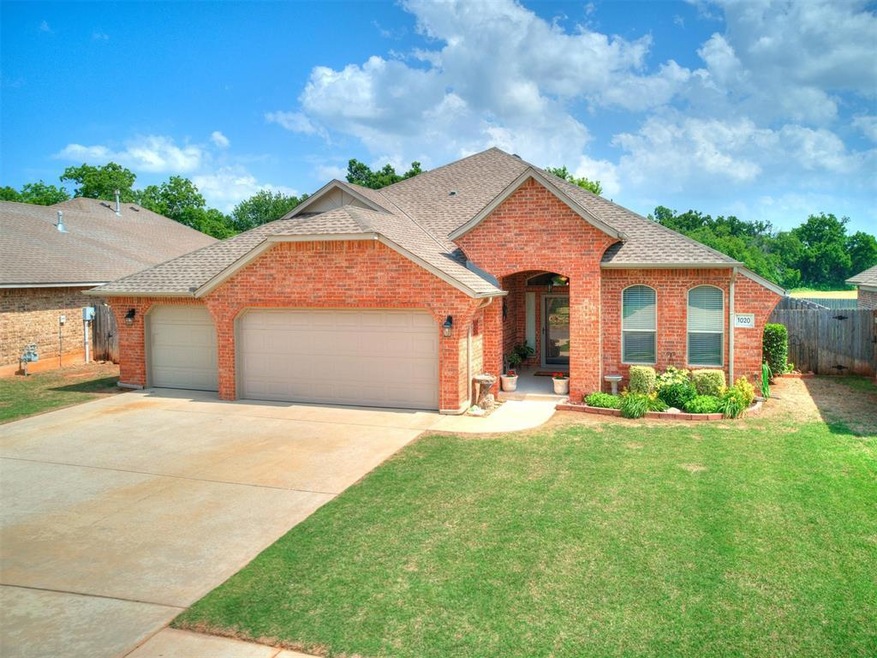 View of front of property featuring a garage and a