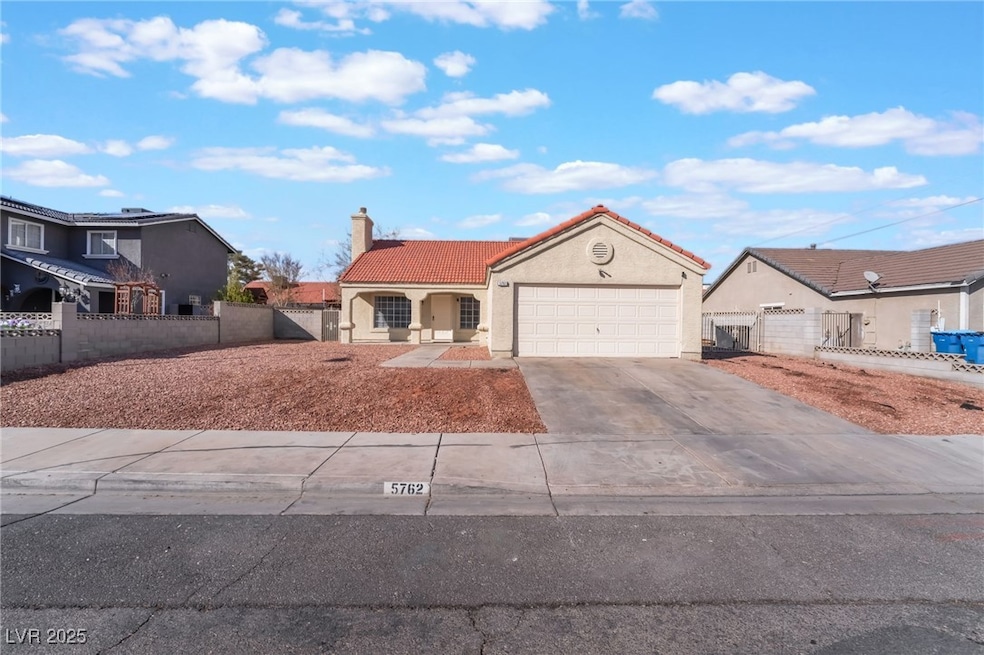 View of front of property featuring concrete drive