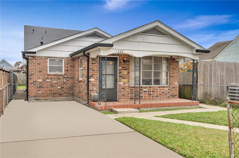Great Front Porch, lots of windows in the front allowing plenty of natural light. Move in or make this home an Income Producing Property.