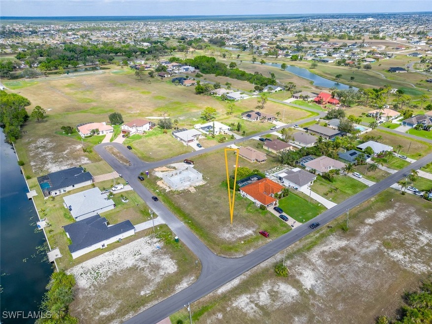 Bird's eye view with a water view and a residentia