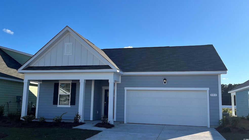 View of front of property with driveway, roof with