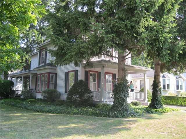 Exterior Front. Charming vinyl sided doubke in hea