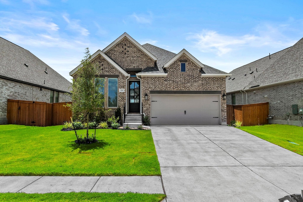 View of front facade featuring an attached garage