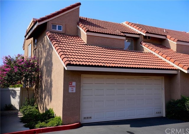 End Unit, w/parking just to the left of garage.
