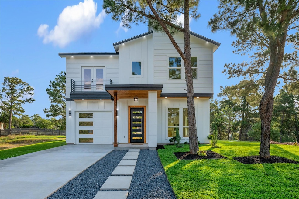 Modern home featuring a balcony, board and batten
