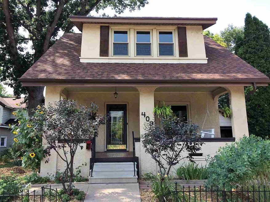 What an inviting entry...and a comfortable porch w