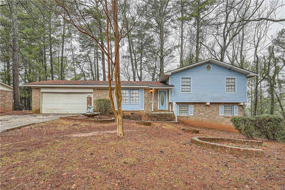 Split level home featuring a garage