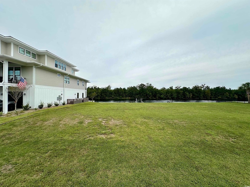 View of yard with a water view