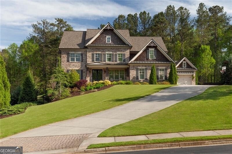 Craftsman-style house featuring a garage and a fro