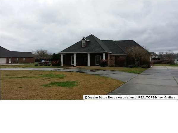 Front view of home with plenty of parking
