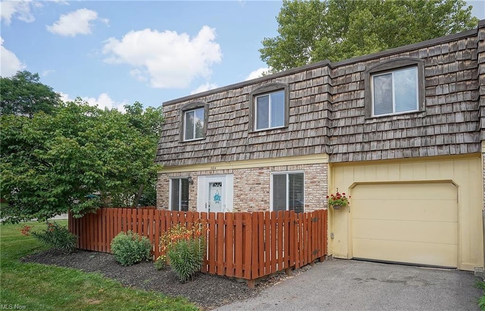 Front view. End Unit. Private patio inside fence.