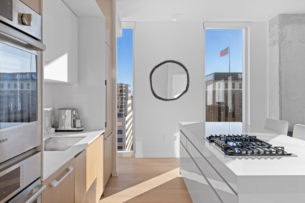 Kitchen with light countertops, light wood-style 
