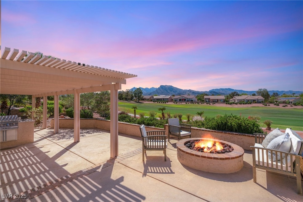 Patio terrace at dusk with a fire pit, a patio are