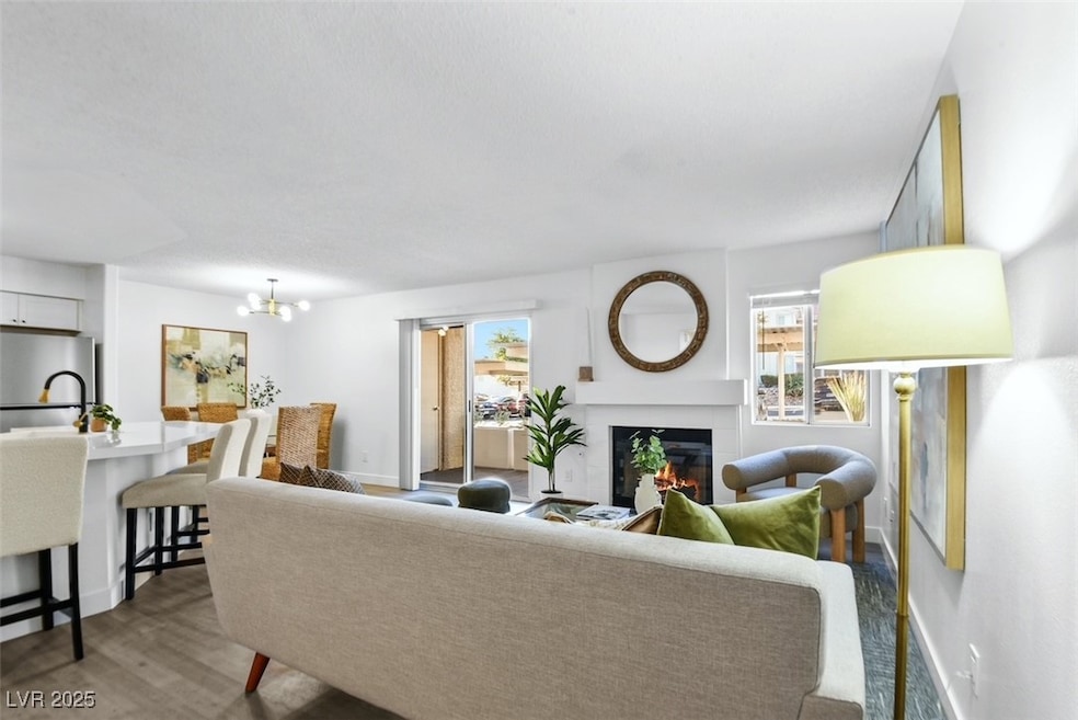 Living room featuring baseboards, a notable chande