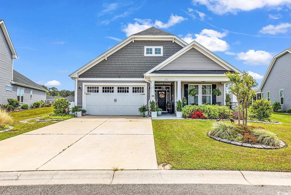 Craftsman inspired home featuring an attached gara