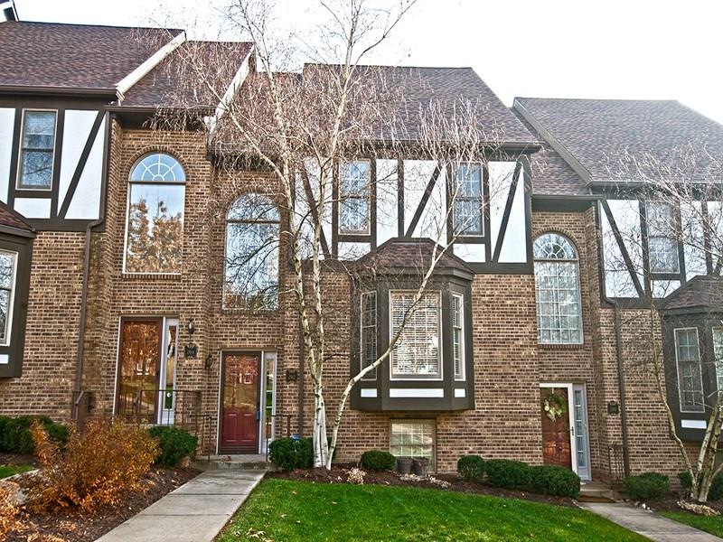 Exterior is brick and tudor w/ bay window and mani