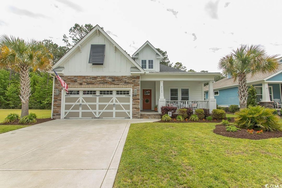 Craftsman-style home featuring a porch, board and 