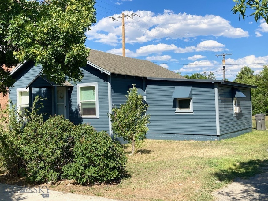 Front of home with large backyard