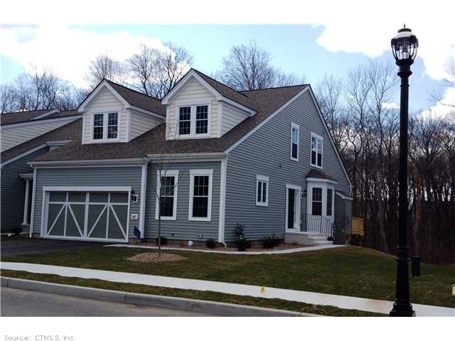 Exterior Front. End unit with wooded views