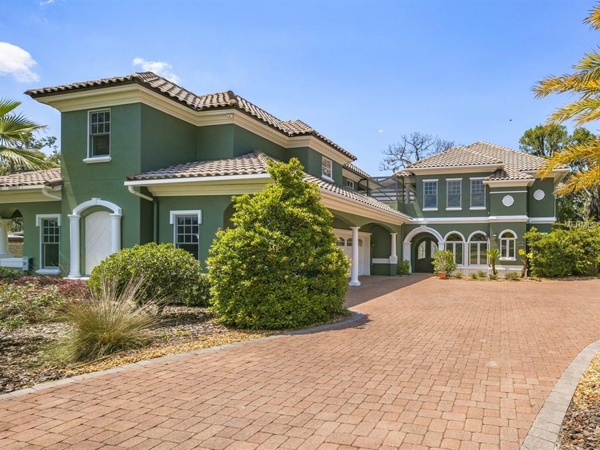 Main exterior with r car side entry garage, tile r