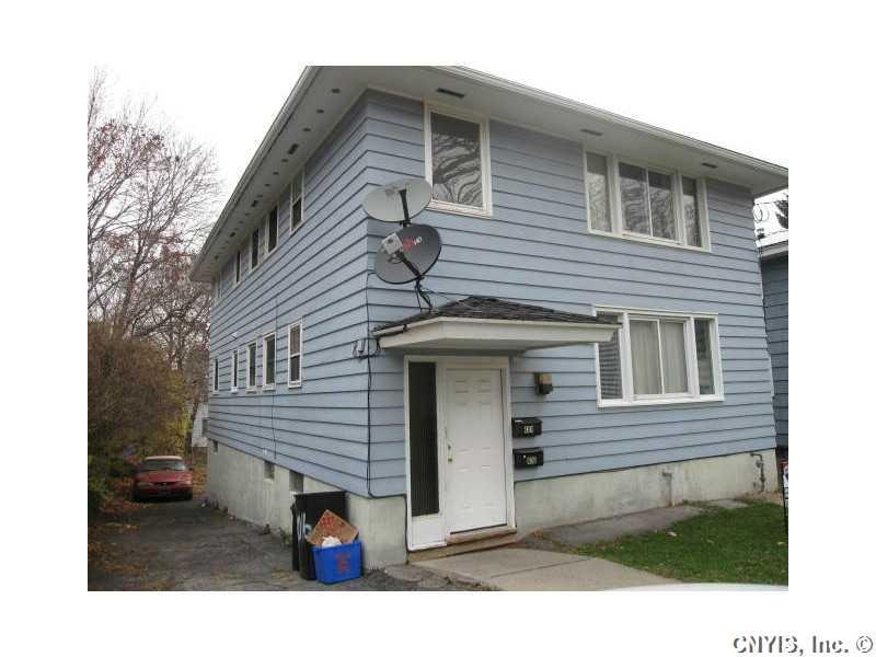 Exterior Front. Single entrance to two flats...