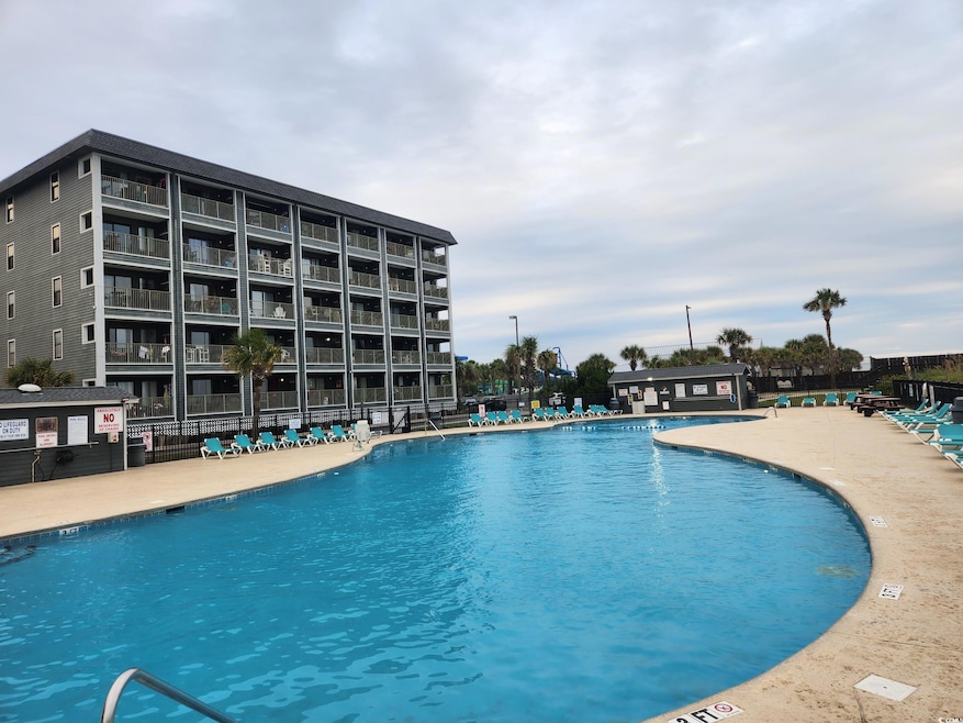 Pool featuring a patio area and fence