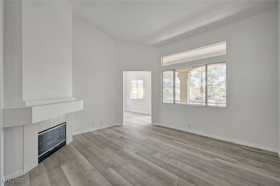 Unfurnished living room featuring a tile fireplace