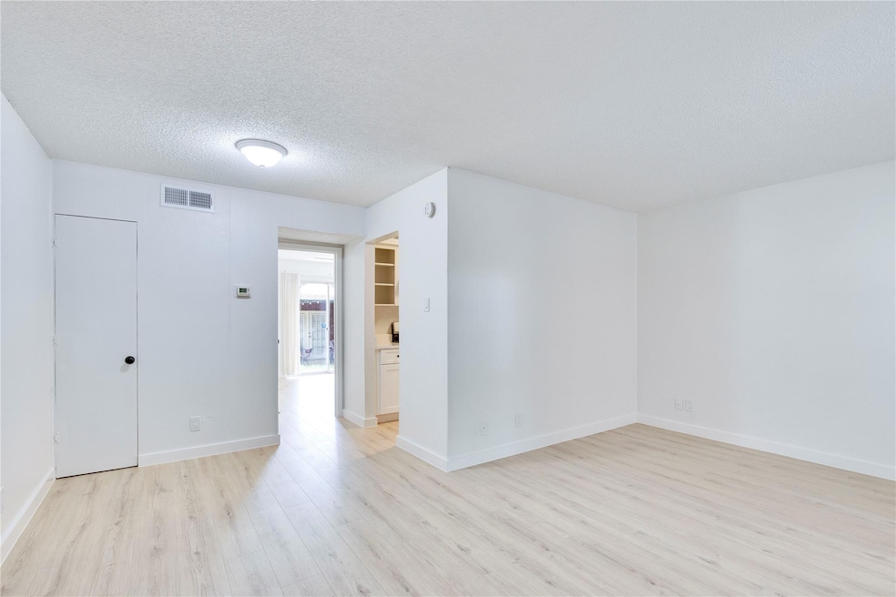 Unfurnished room featuring light wood-type floori