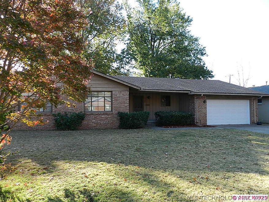 Full brick home with great curb appeal and new gar
