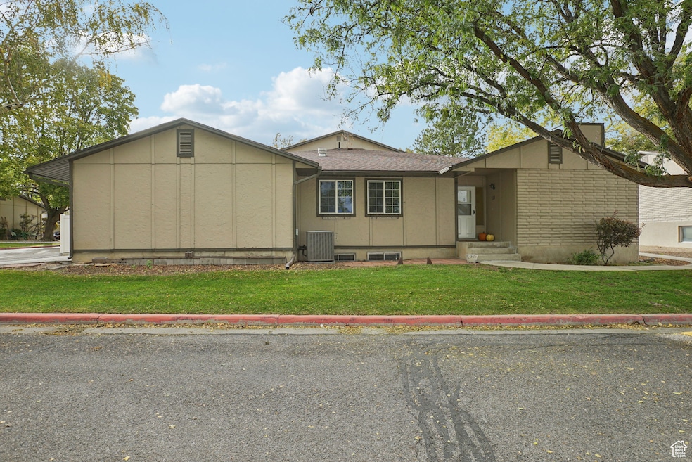 View of front of house with a front yard and entry steps