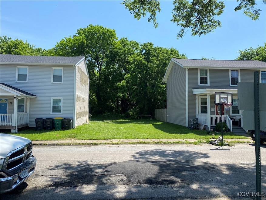 View of side of home with a lawn